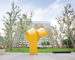 The title of this undulating sculpture suggests that artist Charles O. Perry was inspired by animal horns, but the level of abstraction transcends the reference to nature. Rising from the ground with a slant, the 20-foot, 7-ton bright yellow steel figure curls down, back up and down. It appears to rearrange itself into various configurations when observed from various angles. Seen from one side, the loop appears to spin off the tall base. Viewed from another, it curves neatly against a triangular spire.