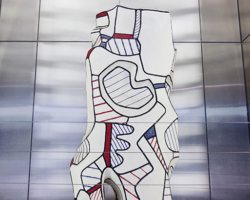 The title is loosely translated as “Encirclement of Limbs” or “Tower of Legs.” Either way, the name clarifies Jean Dubuffet’s theme of building a monolithic structure from entwined elements. The white column is made of epoxy and polyurethane — its numerous contours emphasized by heavily outlined areas filled in with blue, red or black pigment or with stripes in blue or red. The sculpture is part of Dubuffet’s Hourloupe cycle, a prolific period during which he created numerous works in a palette of white, red, blue and black.