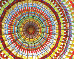 The kaleidoscope-like stained glass dome above Jewel Court at South Coast Plaza was designed by artist Marion Sampler and built by Judson Studios. The magnificent skylight, which measures 30 feet in diameter and is made of 7,200 pieces of glass, changes in color intensity as day turns into night. A site-specific commission, the dome gave Jewel Court its name. It is one of the most photographed features of South Coast Plaza and can be viewed by the public from two levels.